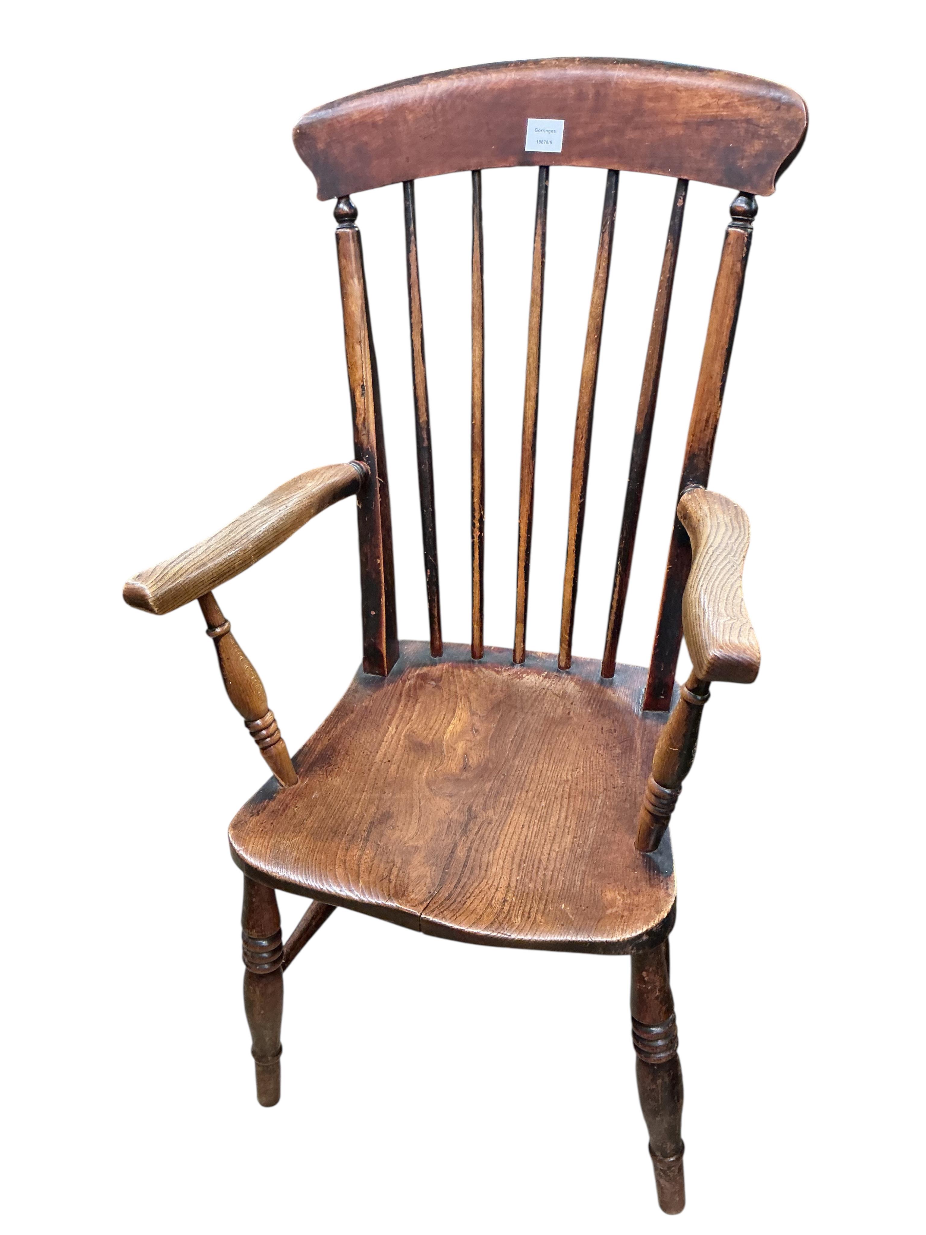 A Victorian elm, ash and beech comb back armchair, width 56cm, depth 45cm, height 107cm
